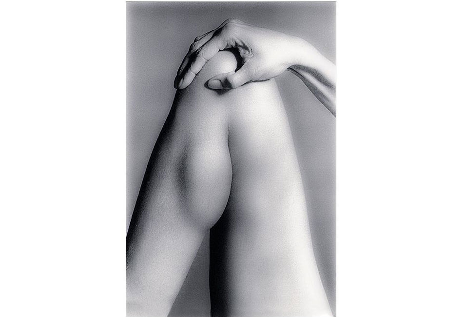 Woman's leg and hand.